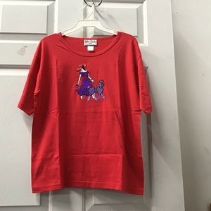 red shirt Get Lucky lady red hat walking purple poodle dog